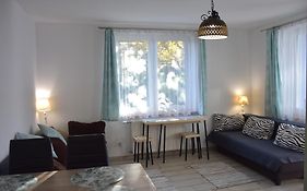 W Ziołowym Ogrodzie - pokoje z dostępną kuchnią, apartament